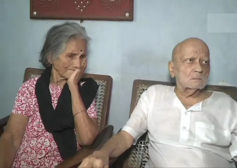 Tears roll down as mother of Deepak Vasant Sathe, pilot of crashed ...